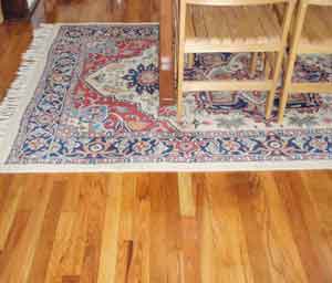 Area rug on re-finished oak floor